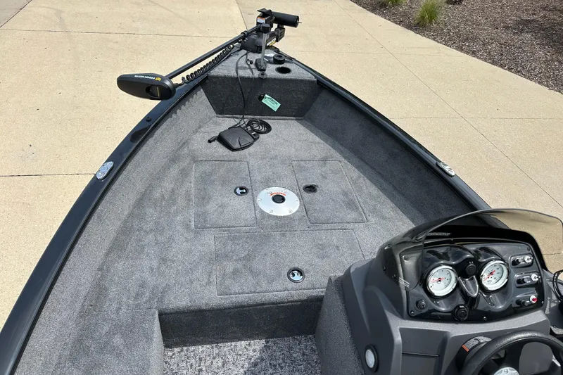 Slide: The Image of 2026 Tracker Super Guide V-16 SC boat interior with steering console and trolling motor. - 3