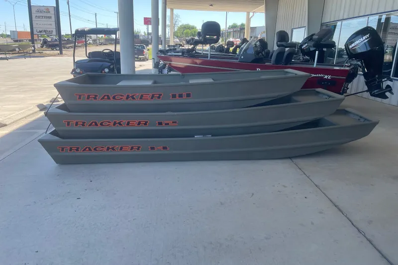 The Image of Three stacked 2026 Tracker Grizzly 10 Jon boats displayed outdoors. - 0