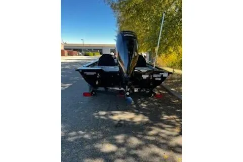 Slide: The Image of 2026 Tracker Pro Team 175 boat parked on a sunny street. - 3