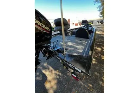 Slide: The Image of 2026 Tracker Pro Team 175 boat with Mercury engine, parked outdoors. - 4