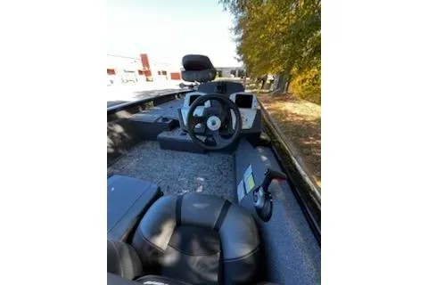 Slide: The Image of 2026 Tracker Pro Team 175 boat interior with steering wheel and seating. - 5