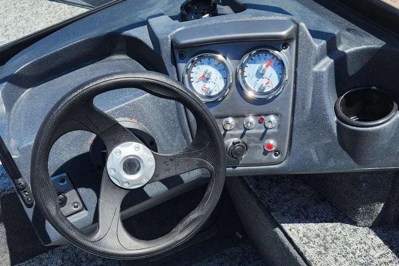 Slide: The Image of 2026 Tracker Pro Guide V-16 WT dashboard with steering wheel and gauges. - 3