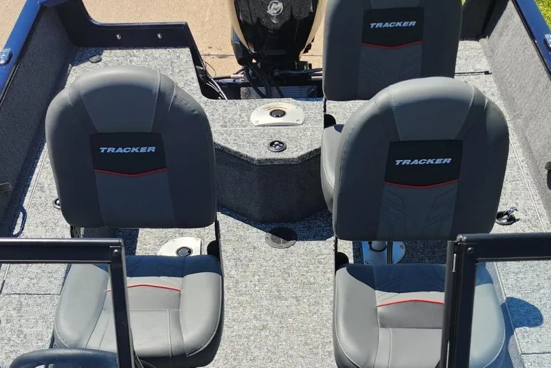 Slide: The Image of 2026 Tracker Pro Guide V-16 WT boat interior with two gray seats. - 5