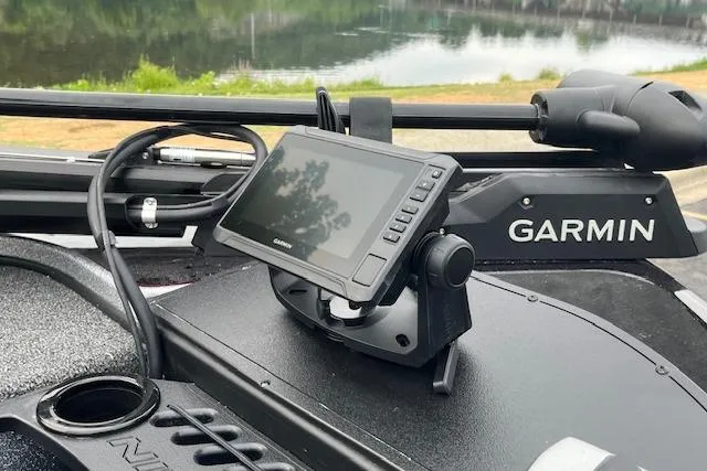 Slide: The Image of Outboard motor on a Nitro Z18 Pro 2026 boat, parked near a lake. - 5