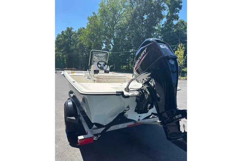Slide: The Image of 2026 Mako Pro Skiff 17 CC boat with Mercury outboard motor on trailer. - 46