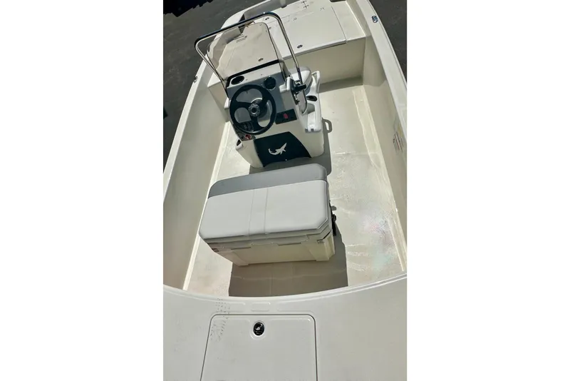 Slide: The Image of 2026 Mako Pro Skiff 17 CC boat interior with steering console and seating. - 47