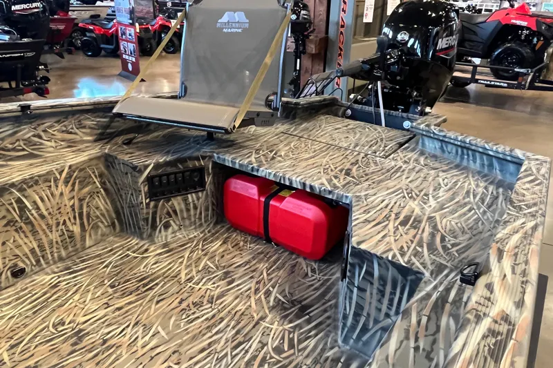 Slide: The Image of 2026 Tracker Grizzly 1650 T Prairie Wings Edition boat with camo design and red fuel tank. - 4