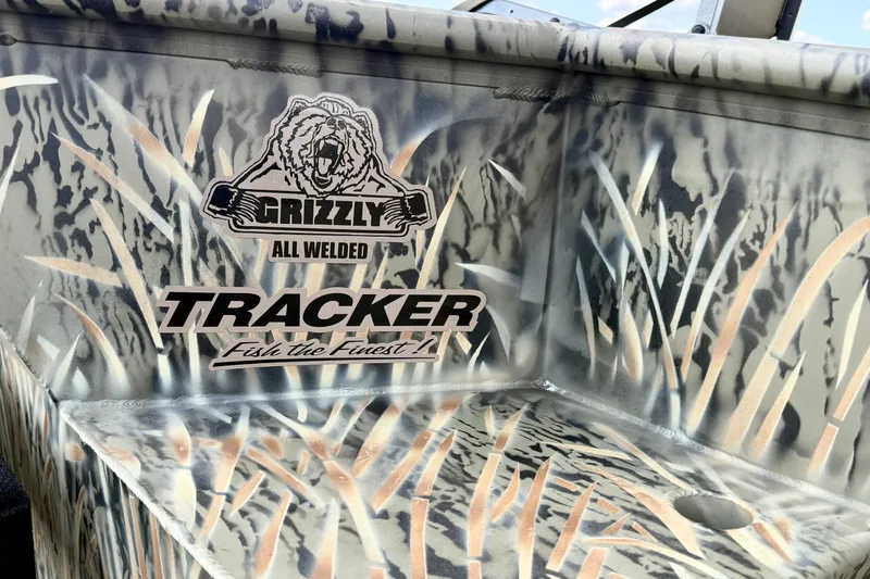 Slide: The Image of 2026 Tracker Grizzly 1650 T Prairie Wings Edition with camo design and logo details. - 16
