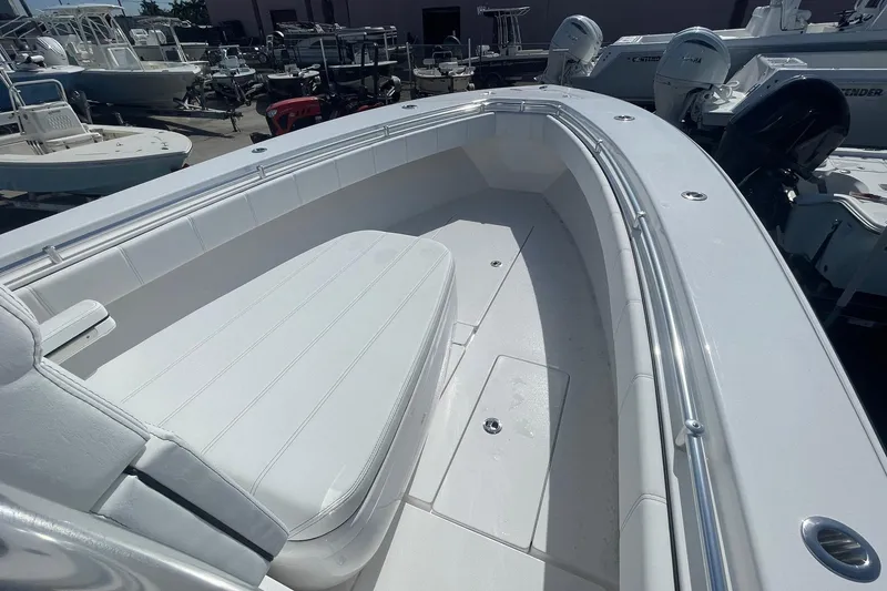 Slide: The Image of 2026 Contender 32 ST boat interior with white seating and sleek design. - 11