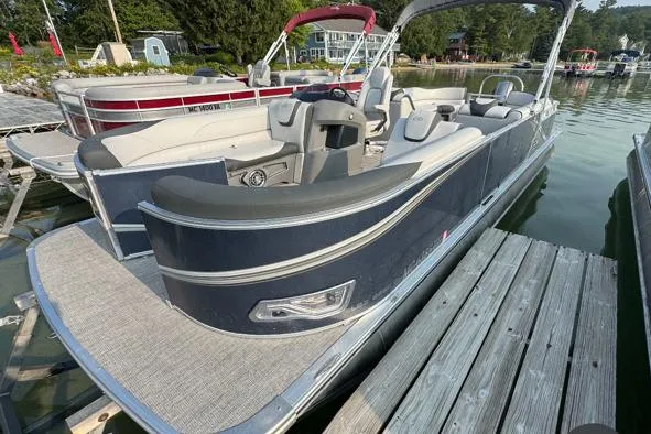 The Image of 2022 Avalon 22 LSZ Quad pontoon boat docked on a sunny day. - 1