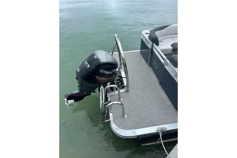Slide: The Image of 2022 Avalon 22 LSZ Quad pontoon boat with Yamaha 115 outboard motor. - 4
