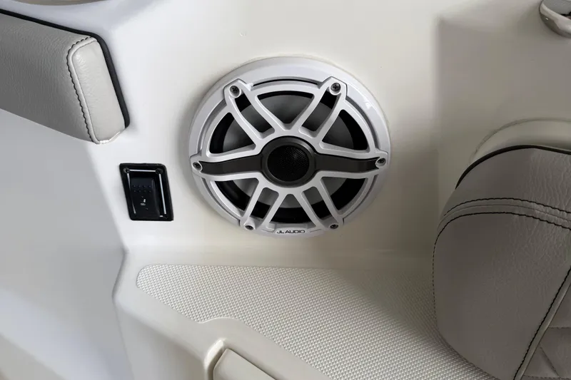 Slide: The Image of Speaker and control panel on 2022 Pursuit S 328 Sport boat interior. - 13