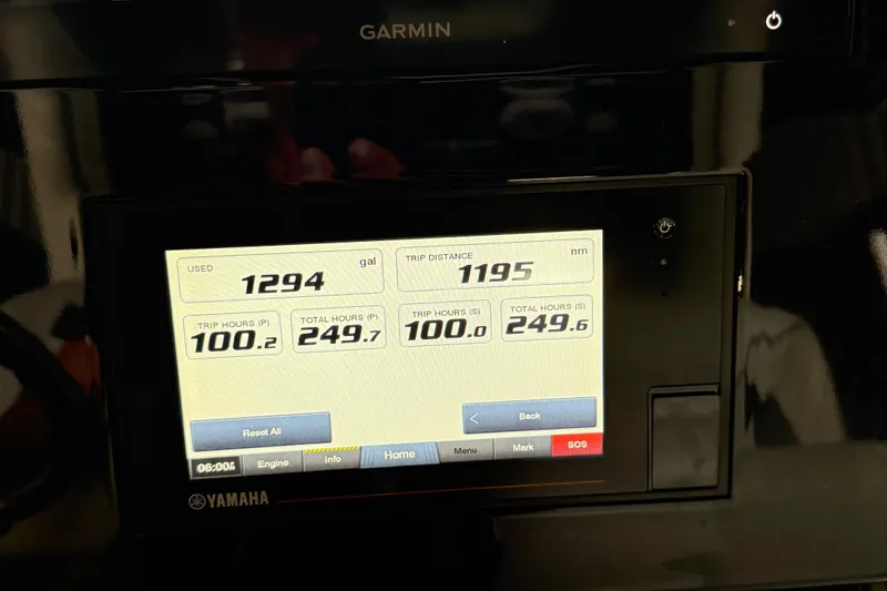 Slide: The Image of Garmin display on 2022 Pursuit S 328 Sport showing fuel and trip data. - 14