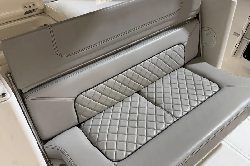 Slide: The Image of 2022 Pursuit S 328 Sport boat seat with quilted gray upholstery. - 7