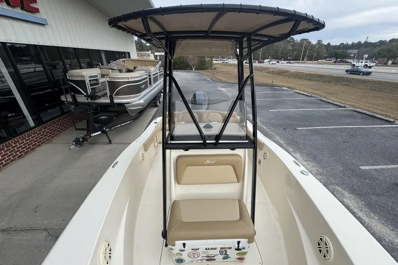 Slide: The Image of 2020 Scout 195 Sportfish boat with T-top, parked near dealership. - 15