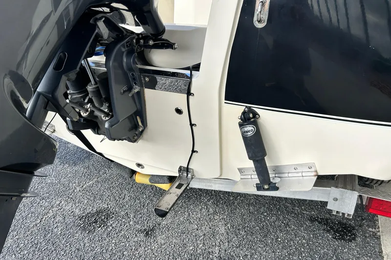 Slide: The Image of 2020 Scout 195 Sportfish boat engine and trim tab detail. - 3