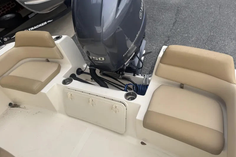 Slide: The Image of 2020 Scout 195 Sportfish boat with Yamaha 150 engine and beige seating. - 7