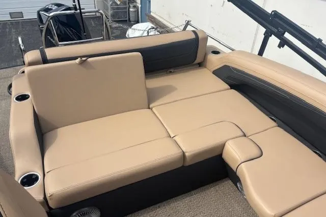 Slide: The Image of 2026 Barletta C22UC boat interior with beige seating and cup holders. - 11