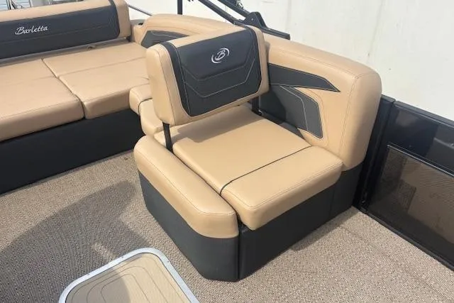 Slide: The Image of 2026 Barletta C22UC boat interior with beige and black seating. - 7