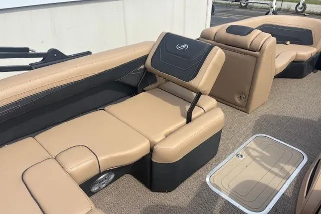 Slide: The Image of 2026 Barletta C22UC boat interior with tan and black seating, showcasing luxury and comfort. - 8