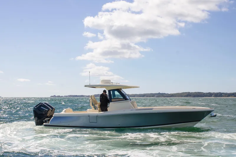 The Image of 2026 Chris-Craft Catalina 31 boat cruising on open water under a clear sky. - 0