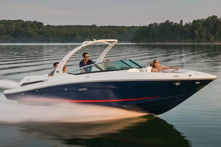 The Image of 2015 Sea Ray 250 SLX speedboat cruising on a serene lake with passengers. - 0