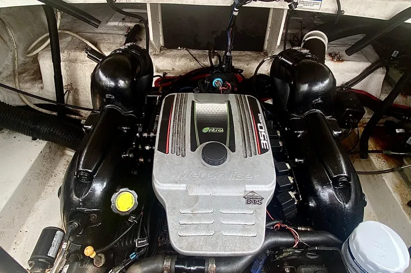 Slide: The Image of 2015 Sea Ray 250 SLX boat engine, featuring a MerCruiser 350 MAG motor. - 10