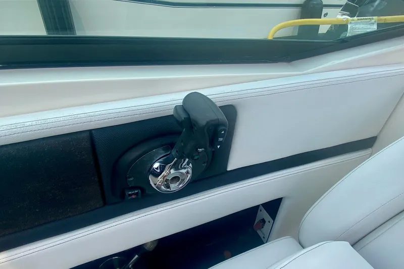 Slide: The Image of Interior view of a 2015 Sea Ray 250 SLX boat throttle control. - 8