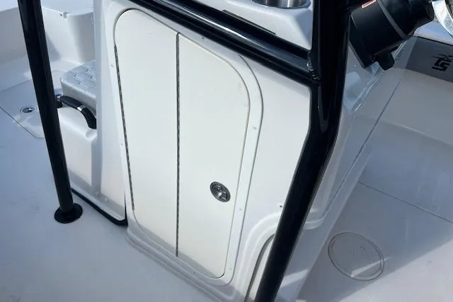Slide: The Image of 2026 Carolina Skiff 24 Ultra Elite boat console with storage compartment and sleek design. - 7
