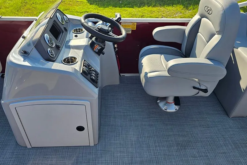 Slide: The Image of 2026 Bentley Pontoons 200 Fish CWT interior with gray seating and storage compartment. - 18