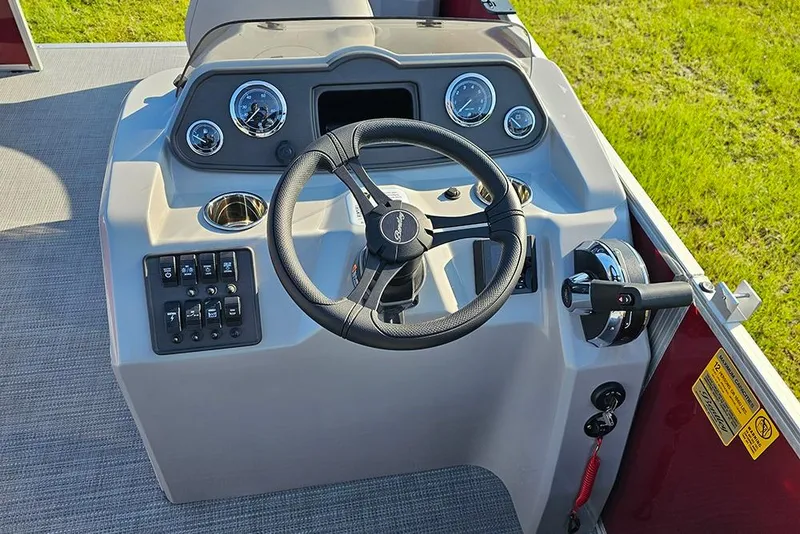 Slide: The Image of 2026 Bentley Pontoons 200 Fish CWT interior with gray seat and red paneling. - 19