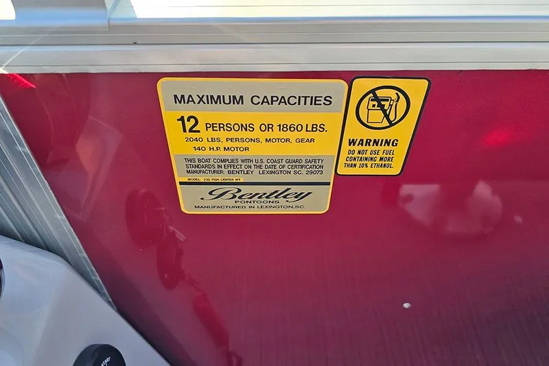 Slide: The Image of 2026 Bentley Pontoons 200 Fish CWT helm with steering wheel and captain's chair. - 20