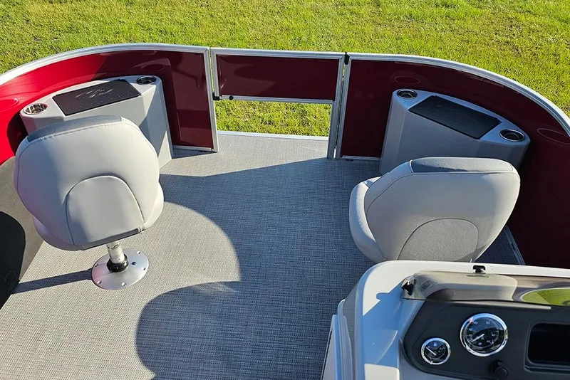 Slide: The Image of 2026 Bentley Pontoons 200 Fish CWT steering console with controls and gauges. - 21