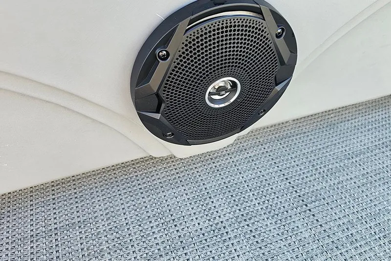 Slide: The Image of 2026 Bentley Pontoons 200 Fish CWT interior with cup holders and storage compartment. - 25