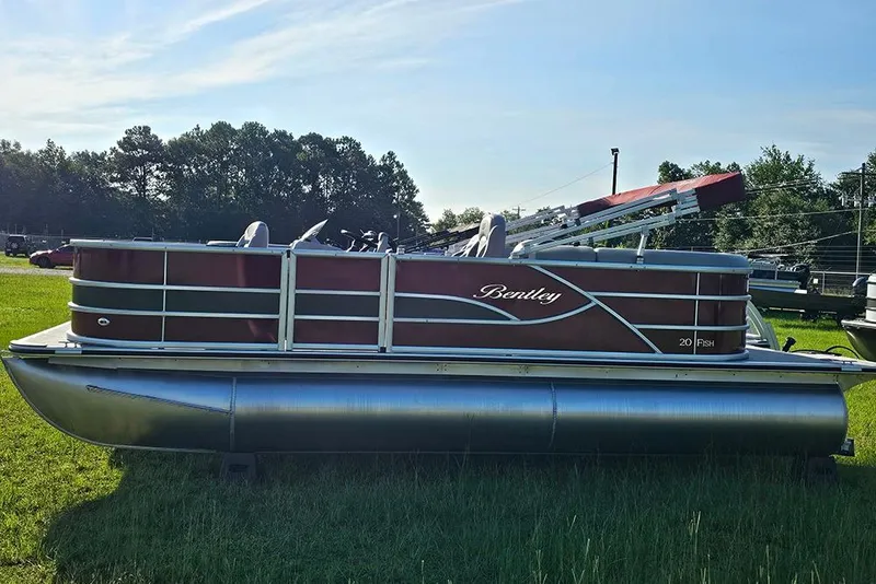 Slide: The Image of 2026 Bentley Pontoons 200 Fish CWT in vibrant red, displayed on grass. - 6