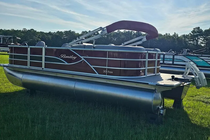 Slide: The Image of 2026 Bentley Pontoons 200 Fish CWT on grass, featuring red and silver design. - 7