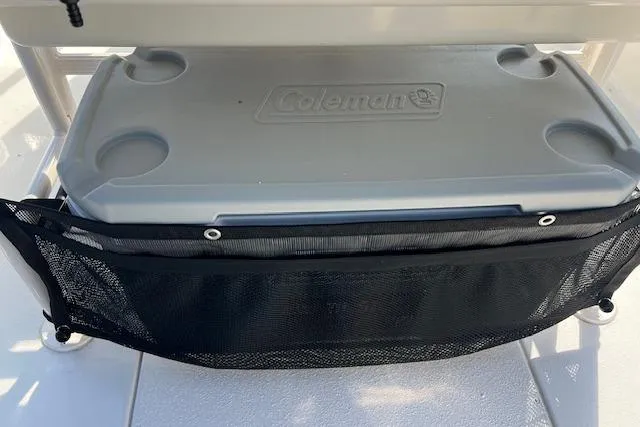 Slide: The Image of 2026 Carolina Skiff 21 LS with Coleman cooler and mesh storage bag. - 3