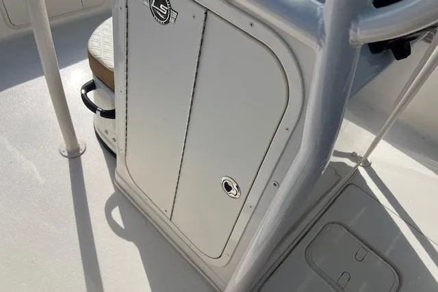 Slide: The Image of 2026 Carolina Skiff 21 LS boat console with storage compartment and seating. - 7