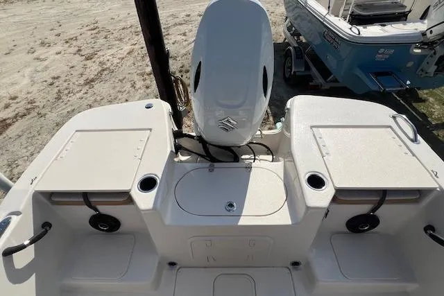 Slide: The Image of 2026 Carolina Skiff 17 LS boat with Suzuki outboard motor, featuring spacious deck and storage compartments. - 3