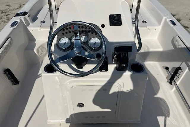 Slide: The Image of 2026 Carolina Skiff 17 LS boat console with steering wheel and gauges. - 5