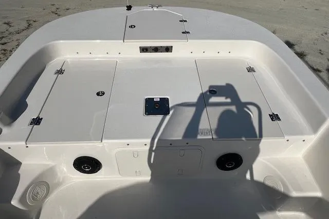 Slide: The Image of 2026 Carolina Skiff 17 LS boat deck with storage compartments and speaker system. - 6