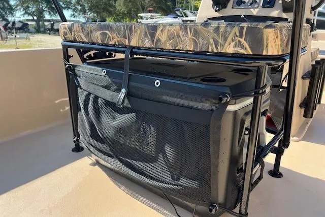 Slide: The Image of 2026 Carolina Skiff E18 JVX CC boat seat with storage and camouflage cushion. - 3