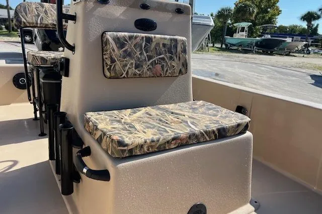 Slide: The Image of 2026 Carolina Skiff E18 JVX CC boat interior with camo-patterned seating. - 8