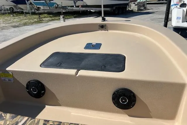 Slide: The Image of 2026 Carolina Skiff E18 JVX CC boat deck with speakers and storage compartment. - 9