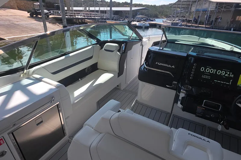 Slide: The Image of Interior of 2026 Formula 360 Crossover Bowrider I/O, featuring sleek seating and modern dashboard. - 22