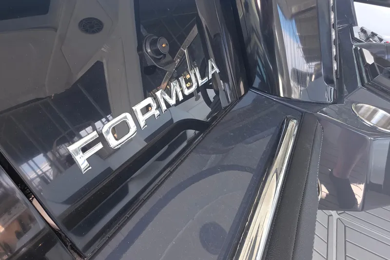 Slide: The Image of 2026 Formula 360 Crossover Bowrider I/O boat, sleek design with chrome accents. - 24