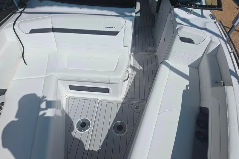 Slide: The Image of 2026 Formula 360 Crossover Bowrider I/O interior with white seating and deck. - 29
