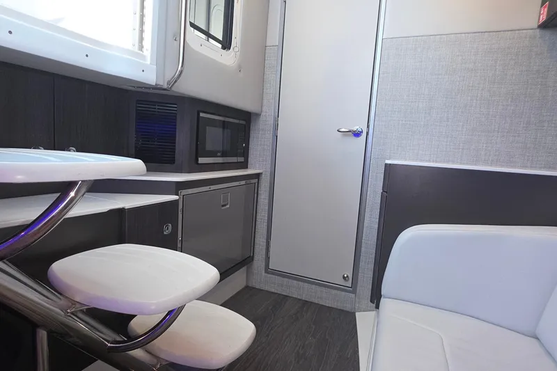 Slide: The Image of Interior of 2026 Formula 360 Crossover Bowrider I/O, featuring modern kitchenette and seating. - 38