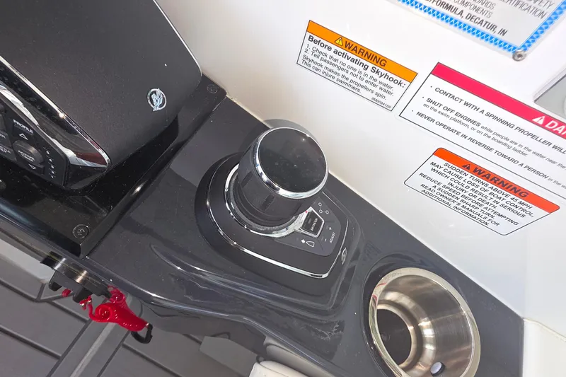 Slide: The Image of 2026 Formula 360 Crossover Bowrider I/O control panel with warning labels and joystick. - 43