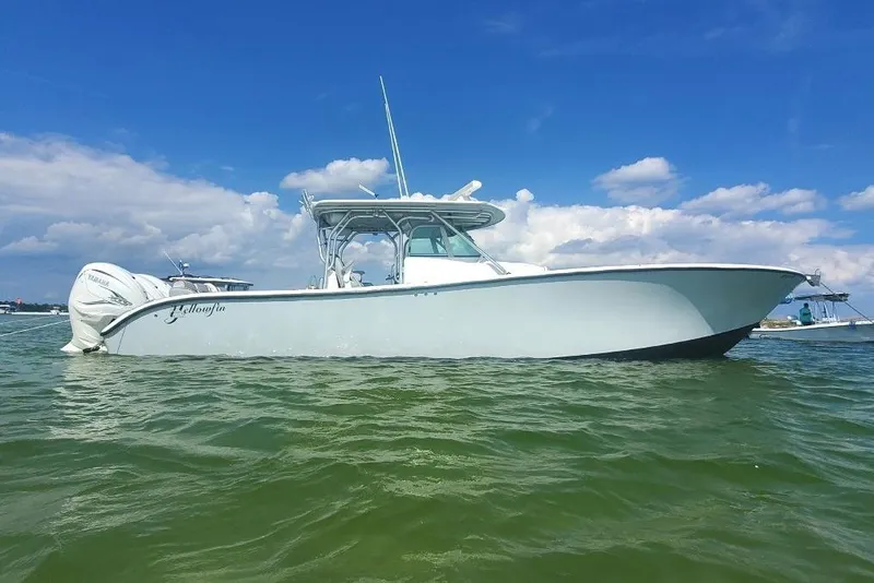 The Image of 2012 Yellowfin 42 Offshore boat on water under blue sky. - 0